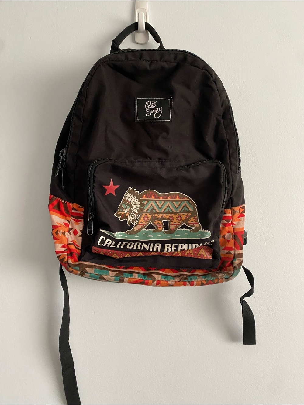 riot society Black Backpack with Multicolor Tribal Bear Graphic